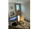 Aerial view of the living room with high ceilings, fireplace, and cozy furniture at 917 Widewaters Pkwy, Knightdale, NC 27545