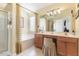 Main bathroom featuring double vanities and a separate tub and shower at 917 Widewaters Pkwy, Knightdale, NC 27545