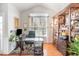 Well-lit home office with modern desk and rustic shelving, ideal for remote work at 917 Widewaters Pkwy, Knightdale, NC 27545