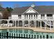 Gorgeous community pool with ample seating and attached clubhouse for neighborhood enjoyment at 917 Widewaters Pkwy, Knightdale, NC 27545