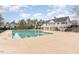 Large community pool surrounded by a concrete deck and neighborhood residential homes at 917 Widewaters Pkwy, Knightdale, NC 27545