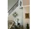 Elegant staircase with detailed iron railings and stylish wall decor at 917 Widewaters Pkwy, Knightdale, NC 27545