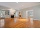 Bright and airy living room showcasing a fireplace, built-in shelving, and hardwood floors at 107 Helmsdale Dr, Chapel Hill, NC 27517