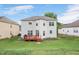 Exterior of home featuring a spacious backyard with a well-kept lawn and back deck at 1106 Bellenden Dr, Durham, NC 27713