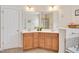 Bathroom showcasing double sink vanity with light cabinets and dual mirrors at 1106 Bellenden Dr, Durham, NC 27713