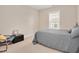 Bedroom features neutral walls, carpet floors, and window bringing in light at 1106 Bellenden Dr, Durham, NC 27713