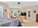 Large, well-lit main bedroom with a ceiling fan and seating area at 1106 Bellenden Dr, Durham, NC 27713