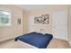 Bedroom features two white doors and natural light from the window at 1106 Bellenden Dr, Durham, NC 27713