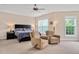 Large bedroom with neutral walls and carpet featuring two tan recliners at 1106 Bellenden Dr, Durham, NC 27713