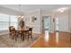 Bright dining room with hardwood floors, large windows, traditional furnishings, and an inviting ambiance at 1106 Bellenden Dr, Durham, NC 27713