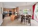Eat-in kitchen featuring stainless steel appliances, tile floors, and a breakfast bar at 1106 Bellenden Dr, Durham, NC 27713
