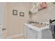 Laundry room with washer, dryer, and shelving for storage of supplies at 1106 Bellenden Dr, Durham, NC 27713
