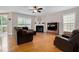 Comfortable living room with hardwood floors, fireplace, and plenty of natural light at 1106 Bellenden Dr, Durham, NC 27713