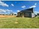 New construction home featuring a covered patio and spacious backyard with newly seeded grass at 130 W Crescent Mills Blvd # Homesite 251, Wilson's Mills, NC 27520