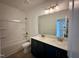 Modern bathroom featuring double sink vanity, bathtub and toilet at 130 W Crescent Mills Blvd # Homesite 251, Wilson's Mills, NC 27520