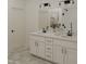 Bathroom with double sinks, modern fixtures, and a shower with glass door at 130 W Crescent Mills Blvd # Homesite 251, Wilson's Mills, NC 27520