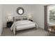 Comfortable bedroom with neutral decor, stylish lamps, and plush carpeting at 130 W Crescent Mills Blvd # Homesite 251, Wilson's Mills, NC 27520
