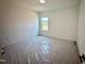 Well-lit bedroom featuring a window overlooking the neighborhood at 130 W Crescent Mills Blvd # Homesite 251, Wilson's Mills, NC 27520