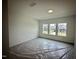 Bright bedroom with multiple windows offering neighborhood views at 130 W Crescent Mills Blvd # Homesite 251, Wilson's Mills, NC 27520