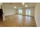 Spacious living room with bright windows and glass doors leading to backyard at 130 W Crescent Mills Blvd # Homesite 251, Wilson's Mills, NC 27520