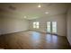 Spacious living room with recessed lighting, a large window, and glass doors leading to the outdoors at 130 W Crescent Mills Blvd # Homesite 251, Wilson's Mills, NC 27520