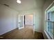 Bright office space with a large window and glass paneled door, offering a modern and professional feel at 130 W Crescent Mills Blvd # Homesite 251, Wilson's Mills, NC 27520