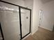 Modern shower stall with black frame and glass door, complimented by light fixtures at 130 W Crescent Mills Blvd # Homesite 251, Wilson's Mills, NC 27520