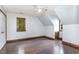 Bright bedroom features hardwood floors, trim accents, and a window with natural light at 1316 Raybon Dr, Wendell, NC 27591