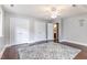 Bedroom with hardwood floors, a ceiling fan, and three large closets for storage at 1316 Raybon Dr, Wendell, NC 27591