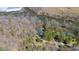 Aerial view of house with mature trees and beautiful river frontage at 1405 N Sellars Mill Rd, Burlington, NC 27217