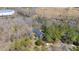 Idyllic aerial view of a home bordered by river, woods and adjacent to commercial space at 1405 N Sellars Mill Rd, Burlington, NC 27217