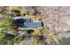 Aerial view of house with mature trees and beautiful river frontage at 1405 N Sellars Mill Rd, Burlington, NC 27217