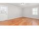 Bedroom featuring a door to the exterior, and bright light from a window at 1405 N Sellars Mill Rd, Burlington, NC 27217