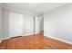Spacious bedroom featuring hardwood floors and fresh neutral paint at 1405 N Sellars Mill Rd, Burlington, NC 27217