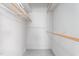 Bright walk-in closet features multiple rods and shelves for optimal organization at 1405 N Sellars Mill Rd, Burlington, NC 27217