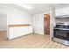 Well-equipped kitchen showcasing bright cabinets and stainless steel appliances with easy access to other rooms at 1405 N Sellars Mill Rd, Burlington, NC 27217