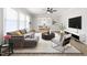 Inviting living room boasts a ceiling fan, comfortable seating, and seamless access to the dining area at 1405 N Sellars Mill Rd, Burlington, NC 27217