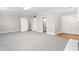 Expansive room with modern carpet and neutral walls leading to other rooms and offering a flexible layout at 1405 N Sellars Mill Rd, Burlington, NC 27217