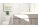Bright bathroom with modern vanity, decor, and large mirror at 1564 Bright Coral Trl, Wendell, NC 27591