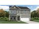 Charming two-story home with a two car garage and stone accents on the front elevation at 1564 Bright Coral Trl, Wendell, NC 27591