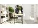 Bright home office with a contemporary desk, stylish chair, and chic decor at 1564 Bright Coral Trl, Wendell, NC 27591