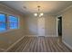 Cozy dining room featuring wood-look floors and a traditional chandelier at 1618 Gerringer Mill Rd, Burlington, NC 27217