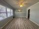 Inviting living room with ample natural light and wood-look flooring at 1618 Gerringer Mill Rd, Burlington, NC 27217