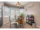 Cozy dining area featuring a glass table, decorative chairs, and lots of natural light at 173 Allie Dr, Garner, NC 27529