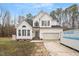 Beautiful two-story home featuring a manicured lawn, attached garage, and classic architectural details at 173 Allie Dr, Garner, NC 27529