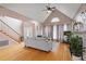 Bright living room showcasing hardwood floors, tall ceilings, comfortable sofa, fireplace, and natural light at 173 Allie Dr, Garner, NC 27529