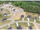 Aerial view of new home construction with other homes and wooded areas at 173 Wild Turkey Way, Lillington, NC 27546