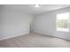 A bright bedroom with natural light and neutral carpet at 173 Wild Turkey Way, Lillington, NC 27546