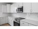 This modern kitchen features white cabinets, stainless steel appliances and white subway tile backsplash at 173 Wild Turkey Way, Lillington, NC 27546