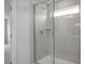 A glass door shower with a hand held shower and tile walls at 173 Wild Turkey Way, Lillington, NC 27546